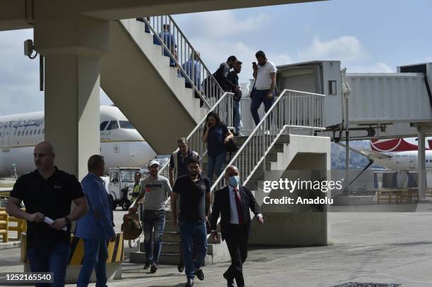 People, including Syrians and Palestinians, evacuated from Sudan with the help of Saudi Arabia and United Arab Emirates land in Beirut International...