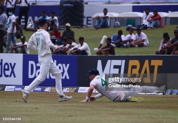 Curtis Campher of Ireland stops ball during the second day of the second Test match between Sri Lanka and Ireland at the Galle International Cricket...