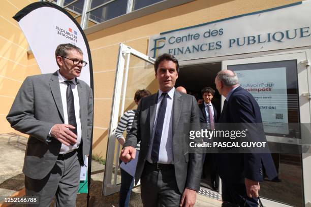 France's Junior Minister for Public Accounts Gabriel Attal leaves the Public Finance Center after a meeting with employees, as part of a visit to...