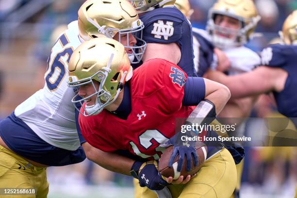 Tyler Buchner is sacked during the Notre Dame Blue-Gold Spring Football Game at Notre Dame Stadium on April 22, 2023 in South Bend, Indiana.