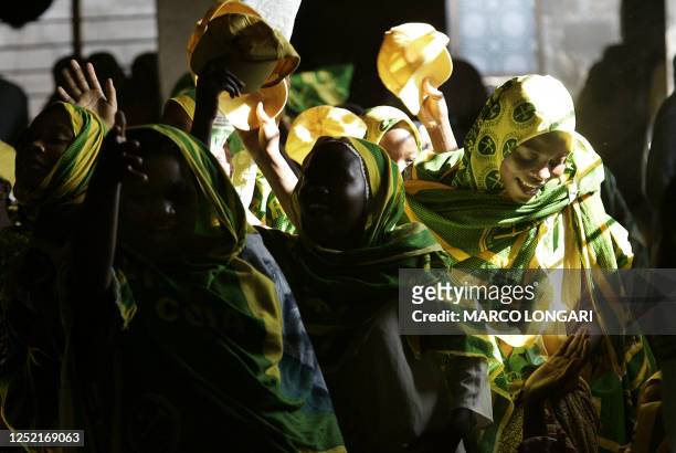 Supporters of the Zanzibar island President Amani Abeid Karume dance 24 October 2005 during a rally of the Presidents' Revolutionary party in Mwembe...