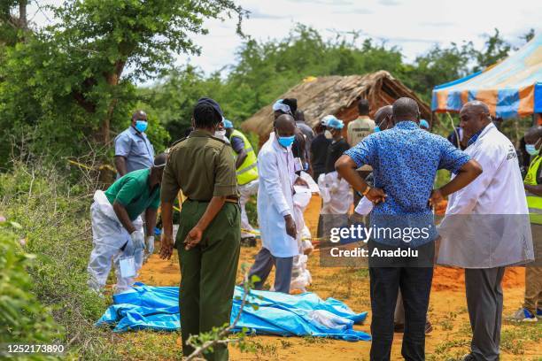 Officials inspect a forested where 90 bodies were found near the Good News International Church in Malindi town of Kilifi, Kenya on April 23, 2023....