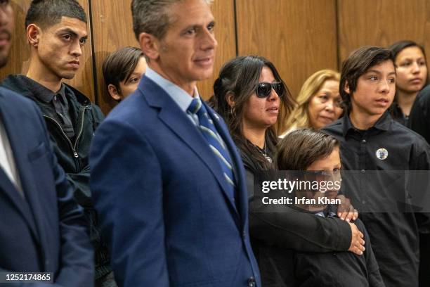 Jonathan Tatami flanked by family members of Anthony Avalos, address a press conference after Heather Barron and Kareem Ernesto Leiva, defendants in...