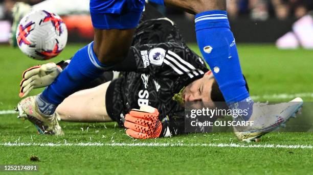 Leeds United's French goalkeeper Illan Meslier stops the ball shot by Leicester City's Nigerian striker Kelechi Iheanacho during the English Premier...