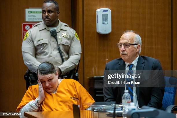 Heather Barron, left, defendant in Anthony Avalos murder case, wipes her tears while listening to victim impact statement by family members. Barron...