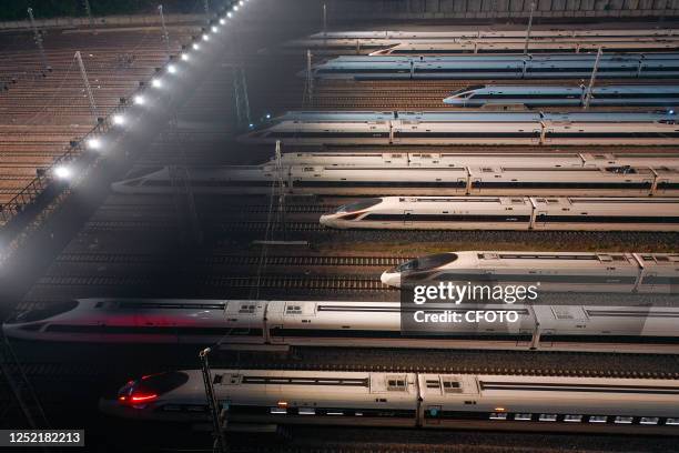 An aerial photo shows bullet trains parked at the Nanjing South Bullet Train station in Nanjing, east China's Jiangsu Province, early on April 26,...