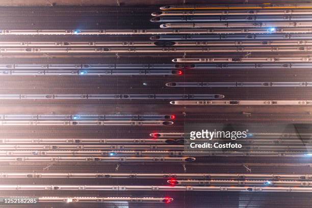 An aerial photo shows bullet trains parked at the Nanjing South Bullet Train station in Nanjing, east China's Jiangsu Province, early on April 26,...