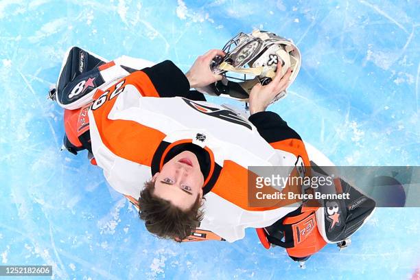 Carter Hart of the Philadelphia Flyers prepares to play against the New York Islanders at the UBS Arena on April 08, 2023 in Elmont, New York. The...