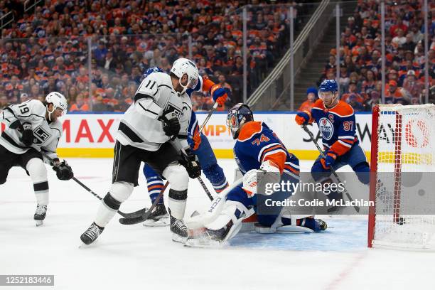 Goaltender Stuart Skinner of the Edmonton Oilers can't stop Alex Iafallo of the Los Angeles Kings from scoring during the first period in Game Five...