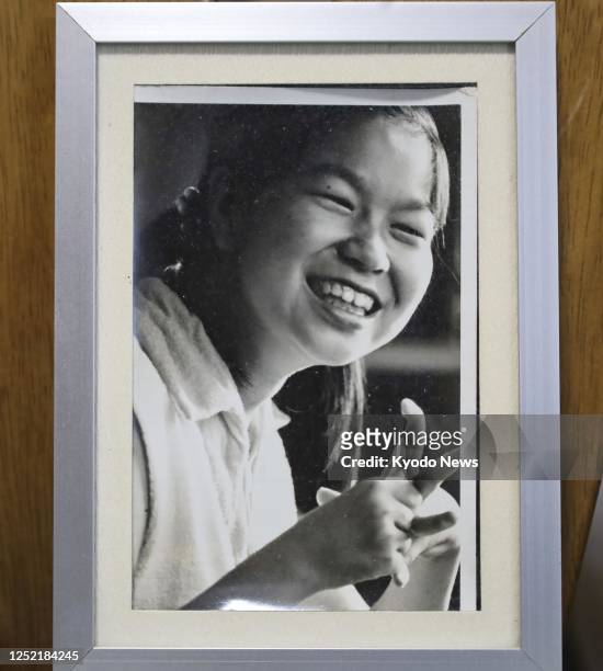 Photo taken on March 24 shows a photo of young Jitsuko Tanaka, one of the first officially recognized patients of Minamata mercury-poisoning disease,...