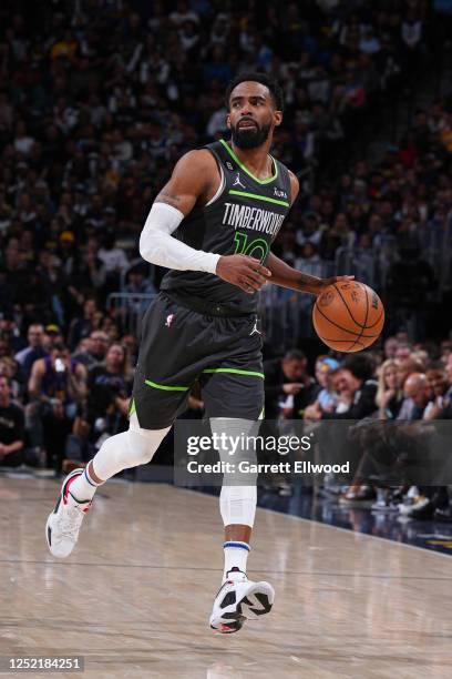 Mike Conley of the Minnesota Timberwolves dribbles the ball during Round One Game Five of the 2023 NBA Playoffs against the Denver Nuggets on April...