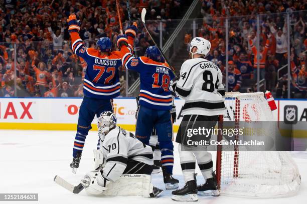 Nick Bjugstad and Zach Hyman of the Edmonton Oilers celebrate a goal against goaltender Joonas Korpisalo of the Los Angeles Kings during the second...
