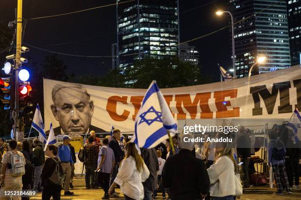 People gather to stage protest against Israeli Prime Minister Benjamin Netanyahu's government's regulations restricting the powers of the judiciary...