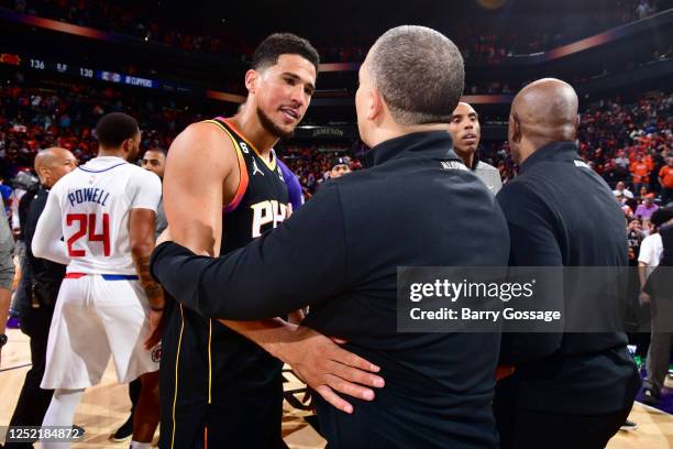 Devin Booker of the Phoenix Suns talks with Head Coach Tyronn Lue of the LA Clippers during Round 1 Game 5 of the 2023 NBA Playoffs on April 25, 2023...