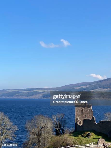 April 2023, Great Britain, Drumnadrochit: View of Urquhart Castle on Loch Ness. It is obvious who plays the leading role around Loch Ness: the legend...