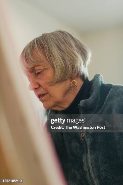 Rebecca Chopp paints in her basement home studio on February 24, 2023. Rebecca was formerly chancellor of the University of Denver when she was...