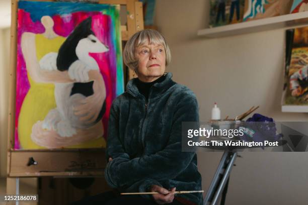 Rebecca Chopp paints in her basement home studio on February 24, 2023. Rebecca was formerly chancellor of the University of Denver when she was...
