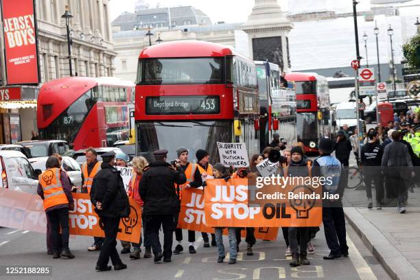 Just Stop Oil demonstrators stage a protest on Waterloo Bridge on April 26, 2023 in London, England.