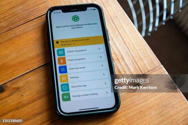 Mobile phone displays the NHS Covid-19 Test and Trace app on 25 April 2023 in Windsor, United Kingdom. Alerts from the contact-tracing app for...