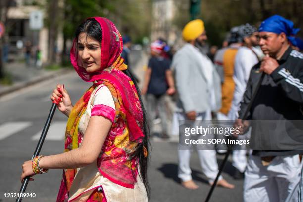 Sevadar clean the street during the procession for the Vaisakhi Nagar Kirtan in Esquiline district. The Sikhs of Rome sang songs of Shabad , prayed,...
