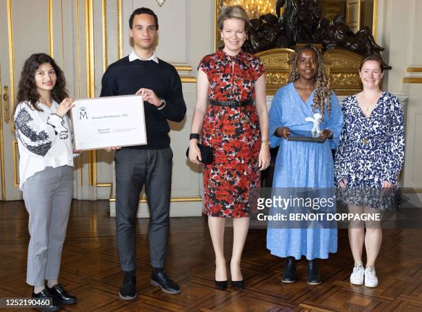 Queen Mathilde of Belgium poses with the laureates of DIALS at the presentation of the Queen Mathilde Prize 'I SEE/IDEA/I DO' of the Queen Mathilde...