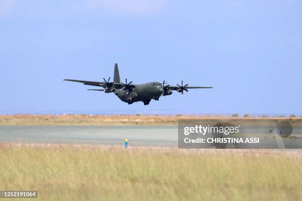 British Royal Air Force C-130 Hercules military transport carrying evacuees from Sudan lands at Larnaca International Airport in Cyprus on April 26,...