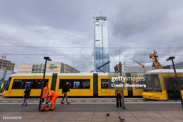 Waste collection worker empties a bin near a tram stop at Alexanderplatz in Berlin, Germany, on Tuesday, April 25, 2023. Germany's economy appears to...