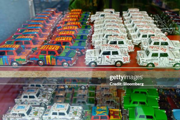 Models of Trabant automobiles on display in the window of a souvenir store in Berlin, Germany, on Tuesday, April 25, 2023. Germany's economy appears...