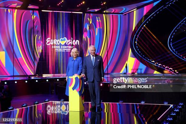 Britain's King Charles III and Britain's Camilla, Queen Consort switch on the stage lighting as they visit the host venue of this year's Eurovision...