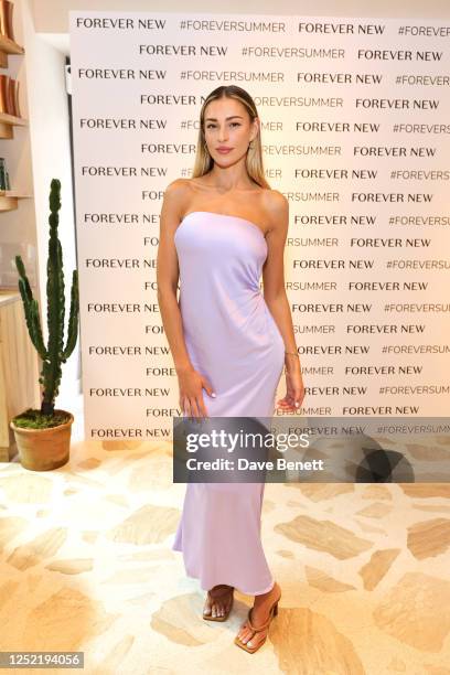 Zara McDermott attends a VIP lunch celebrating the Forever New London flagship store launch in Westfield White City at Milk Beach on April 26, 2023...