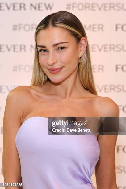 Zara McDermott attends a VIP lunch celebrating the Forever New London flagship store launch in Westfield White City at Milk Beach on April 26, 2023...