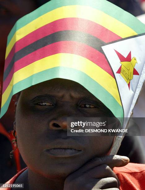 Zimbabwean suppoter of President Robert Mugabe attends a rally in Banket, 70 km from Harare on June 24, 2008. Zimbabwe's run-off election will go...