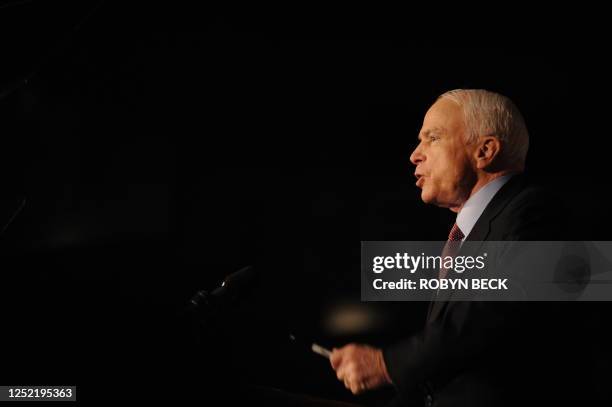 Republican presidential candidate Arizona Senator John McCain gestures with a Sharpie pen during his speech at a campaign rally in Lee's Summit,...