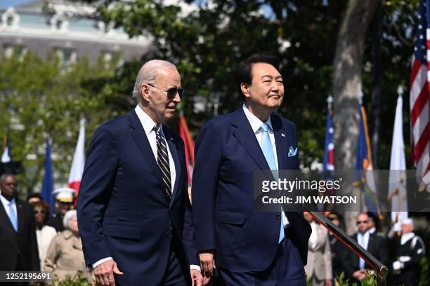 South Korea's President Yoon Suk Yeol and US President Joe Biden participate in a State Arrival ceremony on the South Lawn of the White House April...