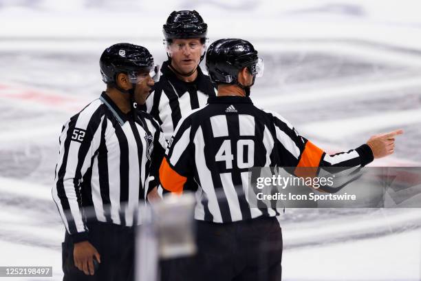 Referees talks in a group during an NHL First Round Western Conference Playoff game between the Edmonton Oilers and the Los Angeles Kings on April 23...