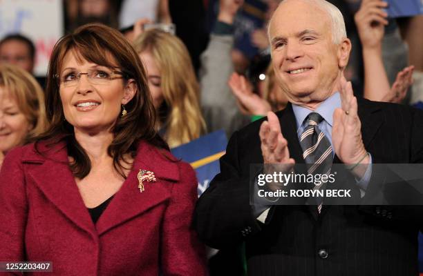 Republican presidential candidate Arizona Senator John McCain and his vice presidential candidate Sarah Palin attend a campaign rally at Giant Center...