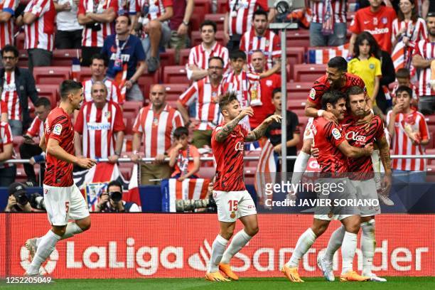 Real Mallorca's Serbian defender Matija Nastasic celebrates with teammates after scoring his team's first goal during the Spanish league football...
