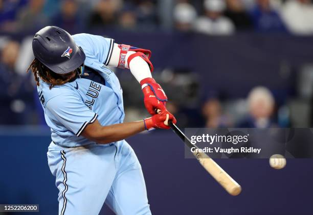 Vladimir Guerrero Jr. #27 of the Toronto Blue Jays hits a two-run double in the third inning against the Chicago White Sox at Rogers Centre on April...