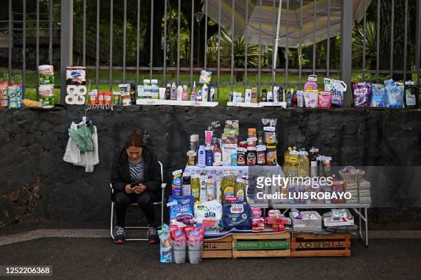 Woman sells household goods at the street in Asuncion on April 26, 2023. - Paraguay holds general and presidential elections on April 30, 2023.
