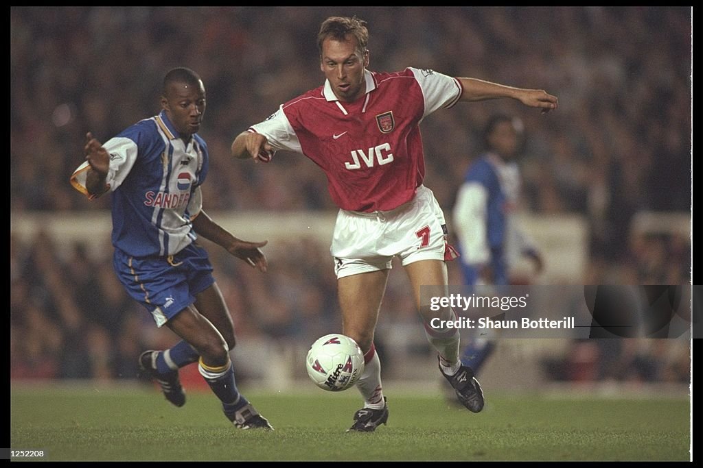 Wayne Collins of Sheffield Wednesday (left) goes to challenge David Platt of Arsenal