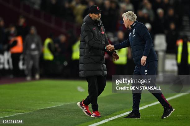 Liverpool's German manager Jurgen Klopp shakes hands with West Ham United's Scottish manager David Moyes at the end of the English Premier League...