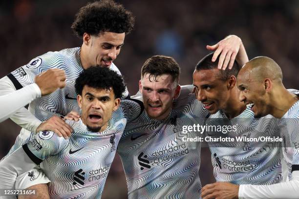 Joel Matip of Liverpool celebrates scoring the winning goal with Luis Diaz, Curtis Jones, Andy Robertson and Fabinho during the Premier League match...