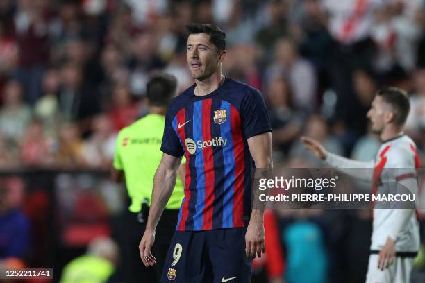 Barcelona's Polish forward Robert Lewandowski reacts during the Spanish league football match between Rayo Vallecano de Madrid and FC Barcelona at...