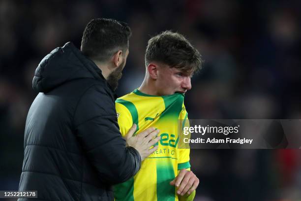 Damia Abella Coach of West Bromwich Albion consoles a distraught Taylor Gardner-Hickman of West Bromwich Albion at the final whistle, after his back...