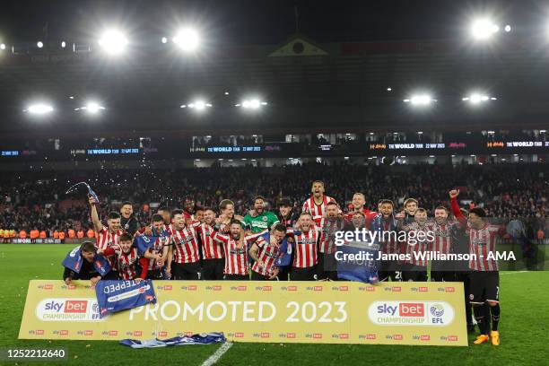 Sheffield United players celebrate being promoted to the Premier League during the Sky Bet Championship between Sheffield United and West Bromwich...