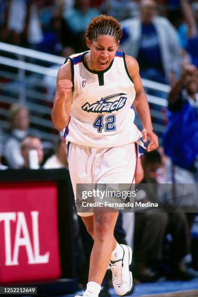 Nykesha Sales of the Orlando Miracle celebrates against the Washington Mystics on June 23, 2001 at TD Waterhouse Centre in Orlando, Florida. NOTE TO...