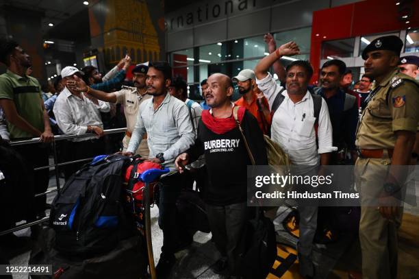 Indian Nationals who were stranded in Sudan arrives back after evacuation from Saudi Arabia at Indira Gandhi International Airport Terminal 3 in New...