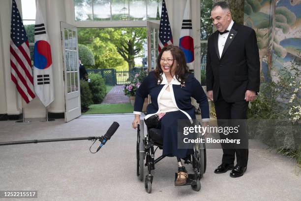 Senator Tammy Duckworth, a Democrat from Illinois, center, and Bryan Bowlsbey arrive to attend a state dinner in honor of South Korean President Yoon...