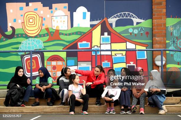 Football player Fern Annalie Longo participates in a skills coaching session with young children from the Mt Roskill Primary School during a New...