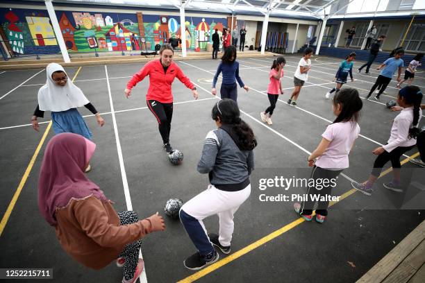 Football player Fern Annalie Longo participates in a skills coaching session with young children from the Mt Roskill Primary School during a New...